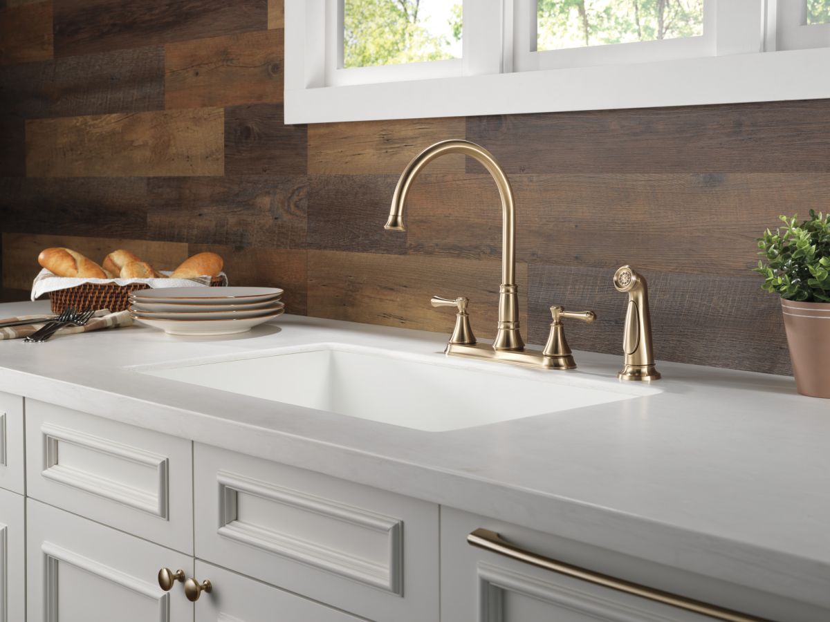 DELTA Cassidy Two Handle Kitchen Faucet with Spray — Champagne Bronze