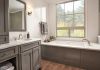 DELTA Dryden Roman Tub with Hand Shower Trim — Stainless
