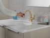 DELTA Stryke Single Handle Pull Down Bathroom Faucet — Lumicoat® Champagne Bronze