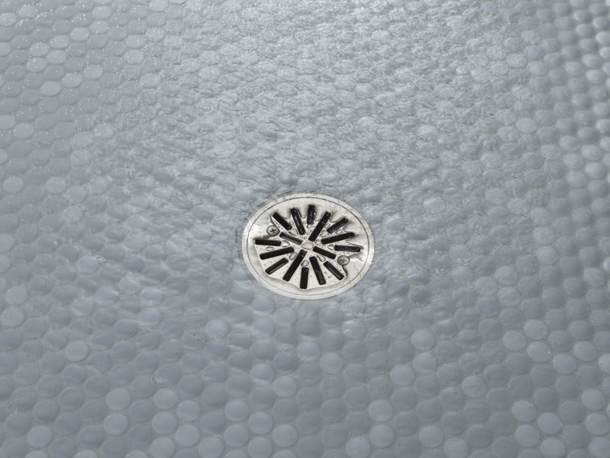 DELTA 4" Tile-In Round Shower Drain — Stainless