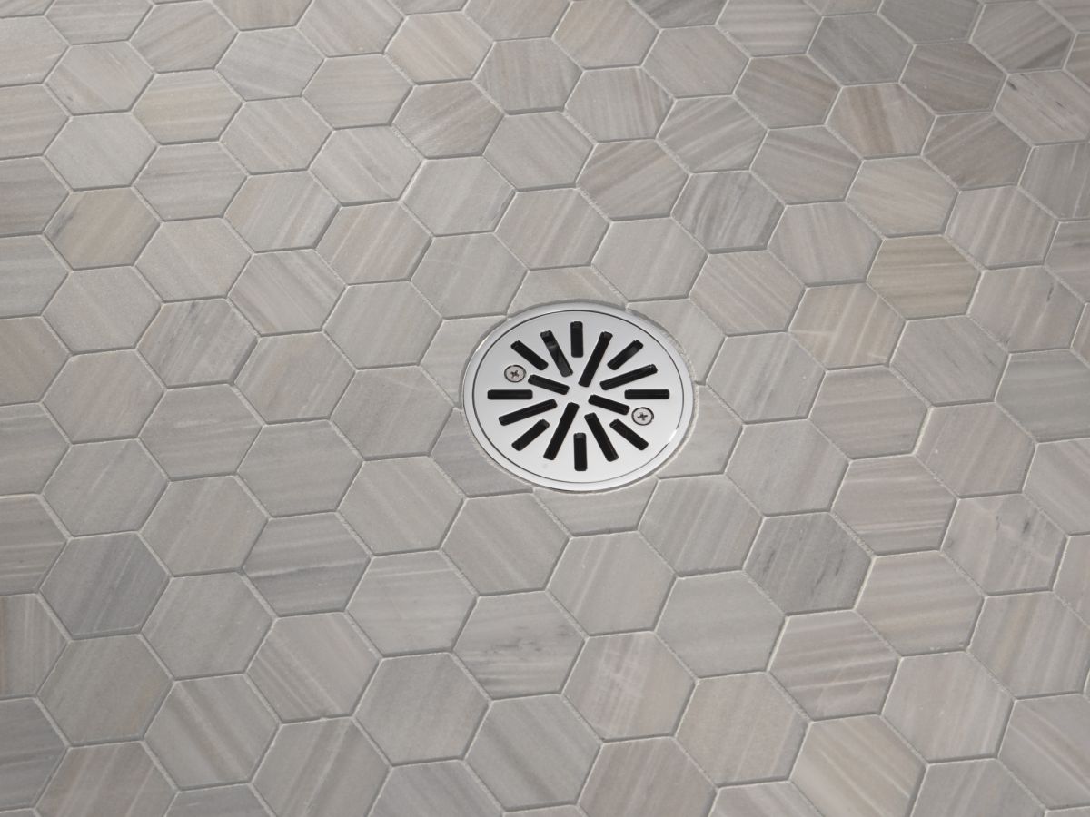 DELTA 4" Tile-In Round Shower Drain — Chrome