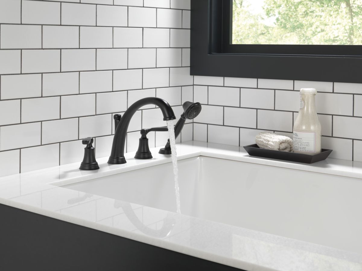 DELTA Woodhurst Roman Tub with Hand Shower Trim — Matte Black