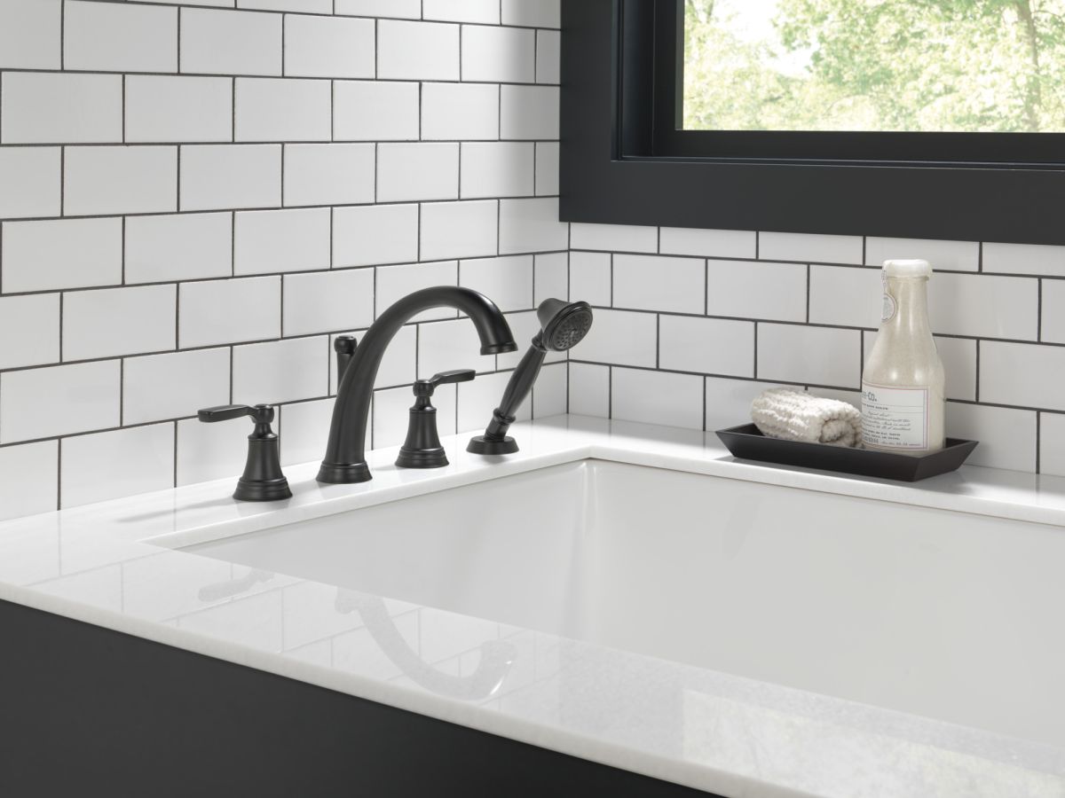 DELTA Woodhurst Roman Tub with Hand Shower Trim — Matte Black