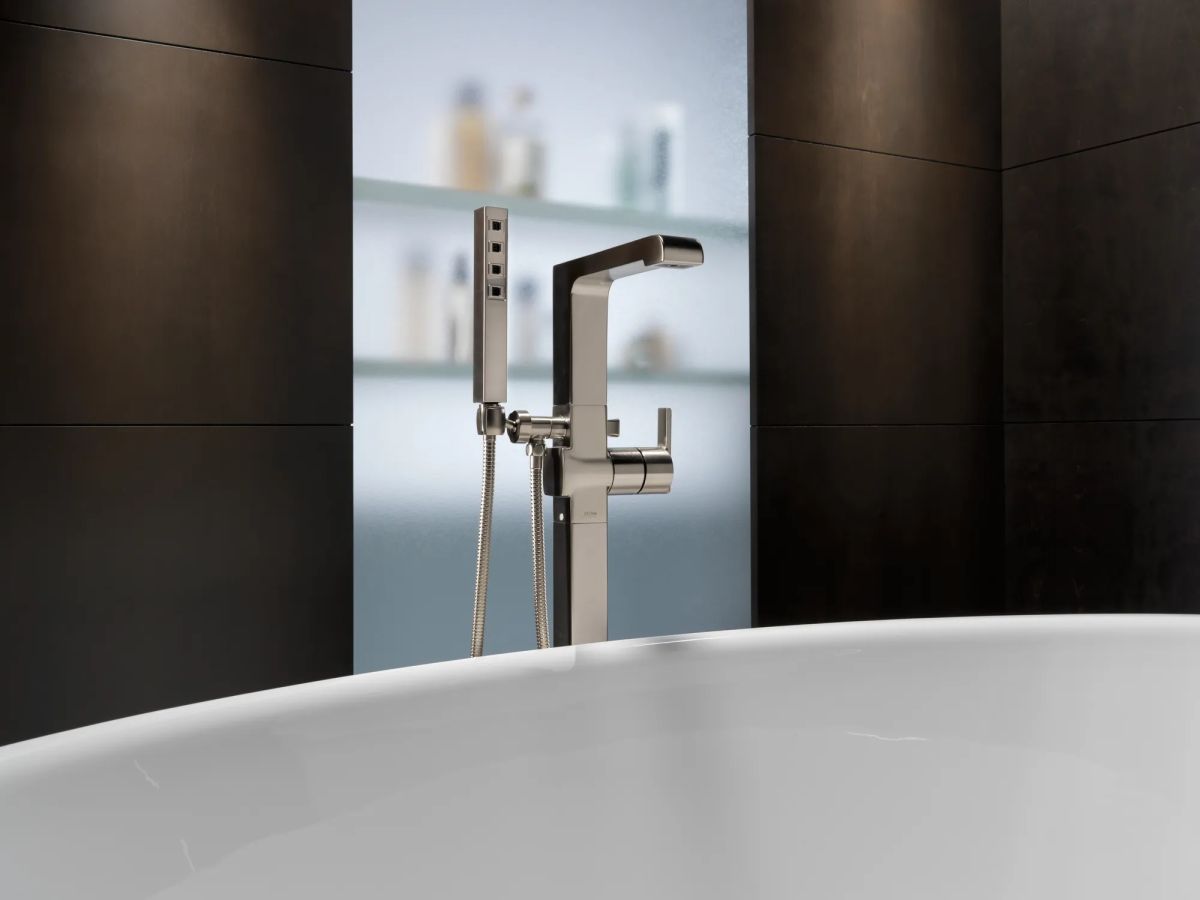 DELTA Ara Single Handle Floor Mount Tub Filler Trim with Hand Shower — Stainless