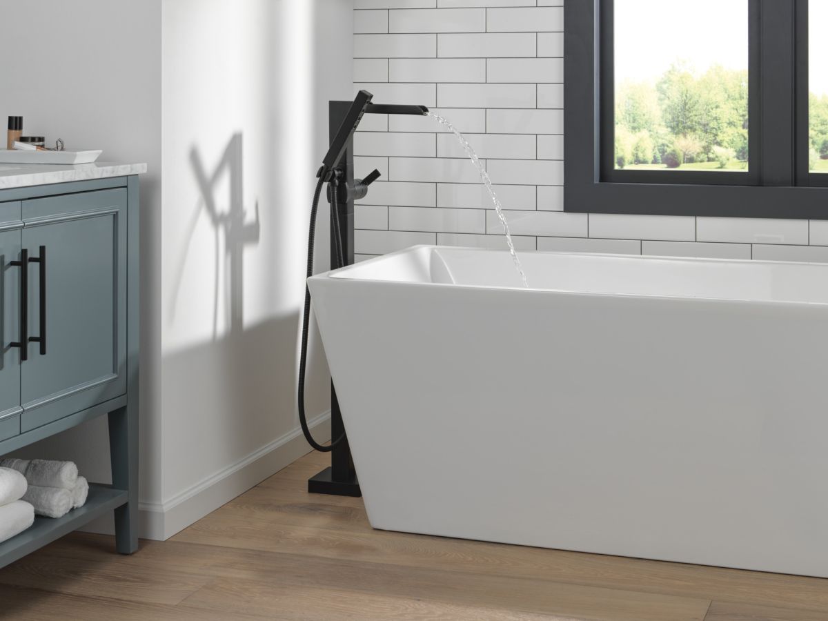 DELTA Ara Single Handle Floor Mount Channel Spout Tub Filler Trim with Hand Shower — Matte Black