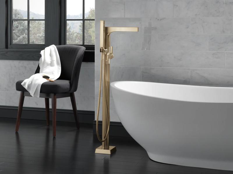 DELTA Zura Single Handle Floor Mount Tub Filler Trim with Hand Shower — Champagne Bronze