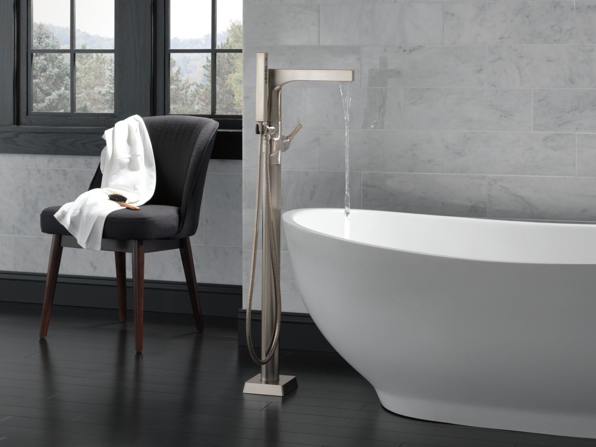 DELTA Zura Single Handle Floor Mount Tub Filler Trim with Hand Shower — Stainless
