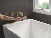 DELTA Bonacci Two Handle Wall Mount Tub Filler Trim with Hand Shower — Lumicoat® Champagne Bronze